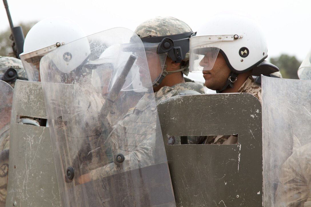 U.S. Soldiers representing the 805th Military Police Company from Cary N.C participate in crowd control training with Alpha 3rd Marine Fleet Antiterrorism Security Team (FAST) and Royal Moroccan Armed Forces during Exercise African Lion 17 April 23, at Tifnit, Morocco. Exercise African Lion is an annually scheduled, combined multilateral exercise designed to improve interoperability and mutual understanding of each nation’s tactics, techniques and procedures.