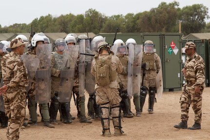 U.S. Soldiers representing the 805th Military Police Company from Cary N.C participate in crowd control training with Alpha 3rd Marine Fleet Antiterrorism Security Team (FAST) and Royal Moroccan Armed Forces during Exercise African Lion 17 April 23, at Tifnit, Morocco. Exercise African Lion is an annually scheduled, combined multilateral exercise designed to improve interoperability and mutual understanding of each nation’s tactics, techniques and procedures.