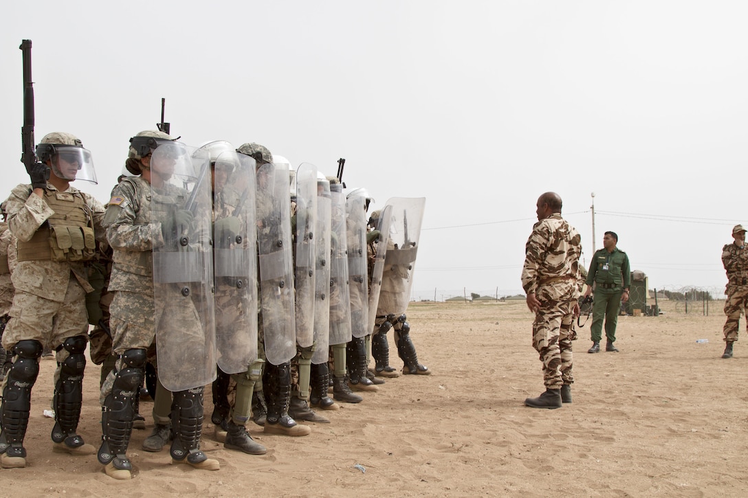 U.S. Soldiers representing the 805th Military Police Company from Cary N.C participate in crowd control training with Alpha 3rd Marine Fleet Antiterrorism Security Team (FAST) and Royal Moroccan Armed Forces during Exercise African Lion 17 April 23, at Tifnit, Morocco.Exercise African Lion is an annually scheduled, combined multilateral exercise designed to improve interoperability and mutual understanding of each nation’s tactics, techniques and procedures.