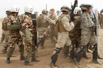 U.S. Soldiers and Marines participate in crowd control training Royal Moroccan Armed Forces during Exercise African Lion 17 April 23, at Tifnit, Morocco. Exercise African Lion is an annually scheduled, combined multilateral exercise designed to improve interoperability and mutual understanding of each nation’s tactics, techniques and procedures.
