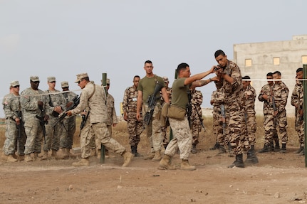 Marine close quarters battle instructors assist and observe U.S. Soldiers, Marines and Royal Moroccan Soldiers at military operations in urbanized terrain training during Exercise African Lion 17 April 24, at Tifnit, Morocco.