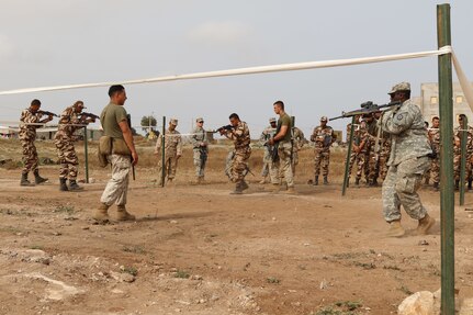 Marine close quarters battle instructors assist and observe U.S. Soldiers, Marines and Royal Moroccan Soldiers at Mount training during Exercise African Lion 17 April 24, at Tifnit, Morocco.