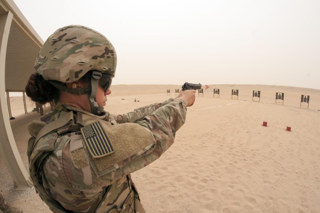 Sgt. Kelly Gary, a Public Affairs NCO with the 29th Infantry Division, fires a M9 pistol during the marksmanship portion of the German Armed Forces Badge qualification. The German Armed Forces Badge for Military Proficiency is one of the most sought after foreign awards in the United States Army. The 316th ESC and the 1st Sustainment Command (Theater) had the privilage of hosting the award qualifications at Camp Arifjan, Kuwait April 27, 2017.