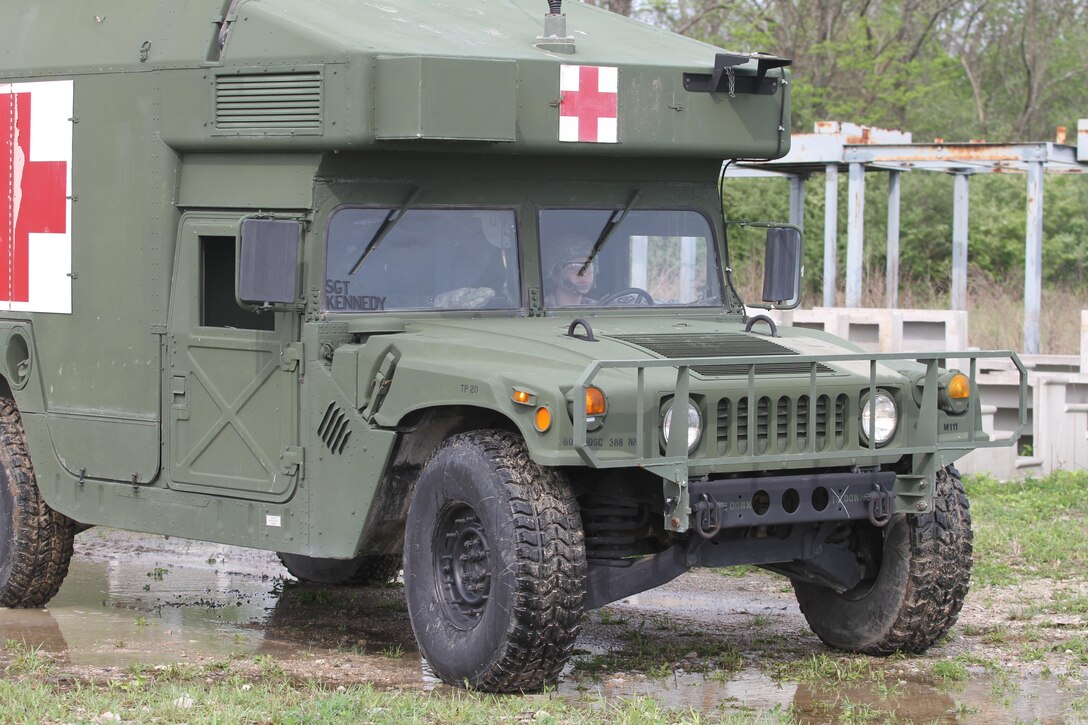 Army Reserve Spc. Bailey Jungmann from the 469th Medical Company, Wichita, Kansas waits patiently behind the wheel of a M997 4 litter HMMWV before a UH-60 Black Hawk helicopter arrives to the landing zone on Responders Support Camp NightHawk, Camp Atterbury, Indiana during Guardian Response 17, April 29, 2017. 

Nearly 5,000 Soldiers and Airmen from across the country are participating in Guardian Response 17, a multi-component training exercise to validate the military's ability to support Civil Authorities in the event of a Chemical, Biological, Radiological, and Nuclear (CBRN) catastrophe. (U.S. Army Reserve photo by Staff Sgt. Christopher Sofia/Released)