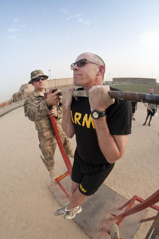 MSG Kevin Hoover, the G4 NCOIC with the 316th Sustainment Command (Expeditionary), participates in the flexed arm-hang during qualifications for the German Armed Forces Badge for Military Proficiency. The 316th ESC and the 1st Sustainment Command (Theater) had the privilage of hosting the award qualifications at Camp Arifjan, Kuwait April 27, 2017.