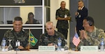 (From left) Gen. Walter Souza Brago Netto, commander of the Eastern Military Command of the Brazilian Army; Maj. Gen. William Georges Felippe Abrahao, conference president and Deputy Chief of Staff of the Brazilian Army; and Maj. Gen. K.K. Chinn, Secretary General of the Conference of American Armies and U.S. Army South commanding general, share a laugh during the opening ceremony of the Specialized Conference on Interagency Operations, in Salvador, Bahia April 10. The event was part of a series of conferences held by the members of the CAA.  