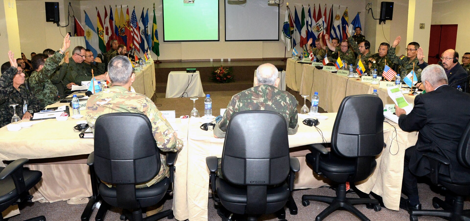 Delegates from the Conference of the American Armies vote on the continuation of topics April 10, during the Specialized Conference on Interagency Operations in Salvador, Bahia.