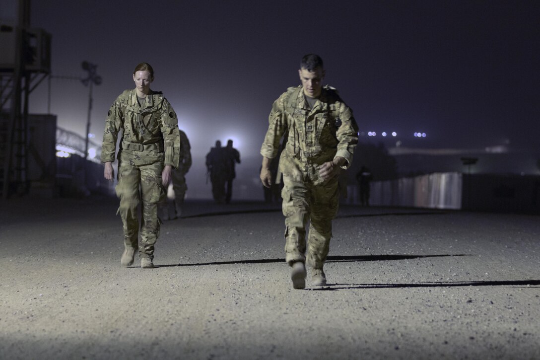 Soldiers ruck during the ruck-march portion of the German Armed Forces Badge qualification. The German Armed Forces Badge for Military Proficiency is one of the most sought after foreign awards in the United States Army. The 316th ESC and the 1st Sustainment Command (Theater) had the privilage of hosting the award qualifications at Camp Arifjan, Kuwait April 27, 2017.