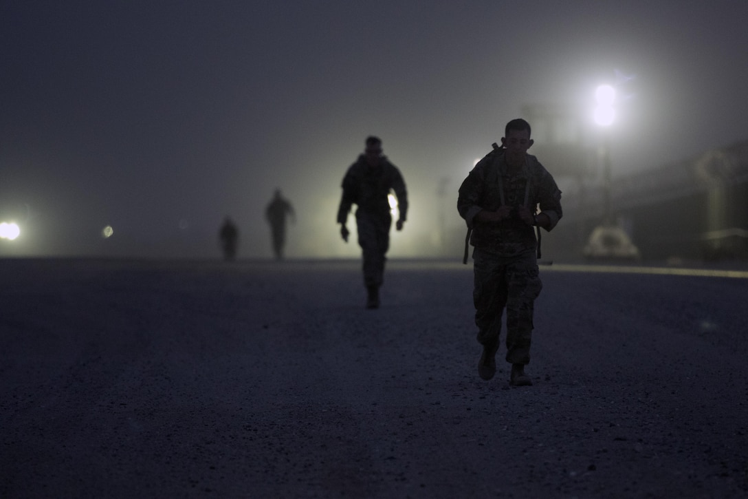 Soldiers ruck during the ruck-march portion of the German Armed Forces Badge qualification. The German Armed Forces Badge for Military Proficiency is one of the most sought after foreign awards in the United States Army. The 316th ESC and the 1st Sustainment Command (Theater) had the privilage of hosting the award qualifications at Camp Arifjan, Kuwait April 27, 2017.