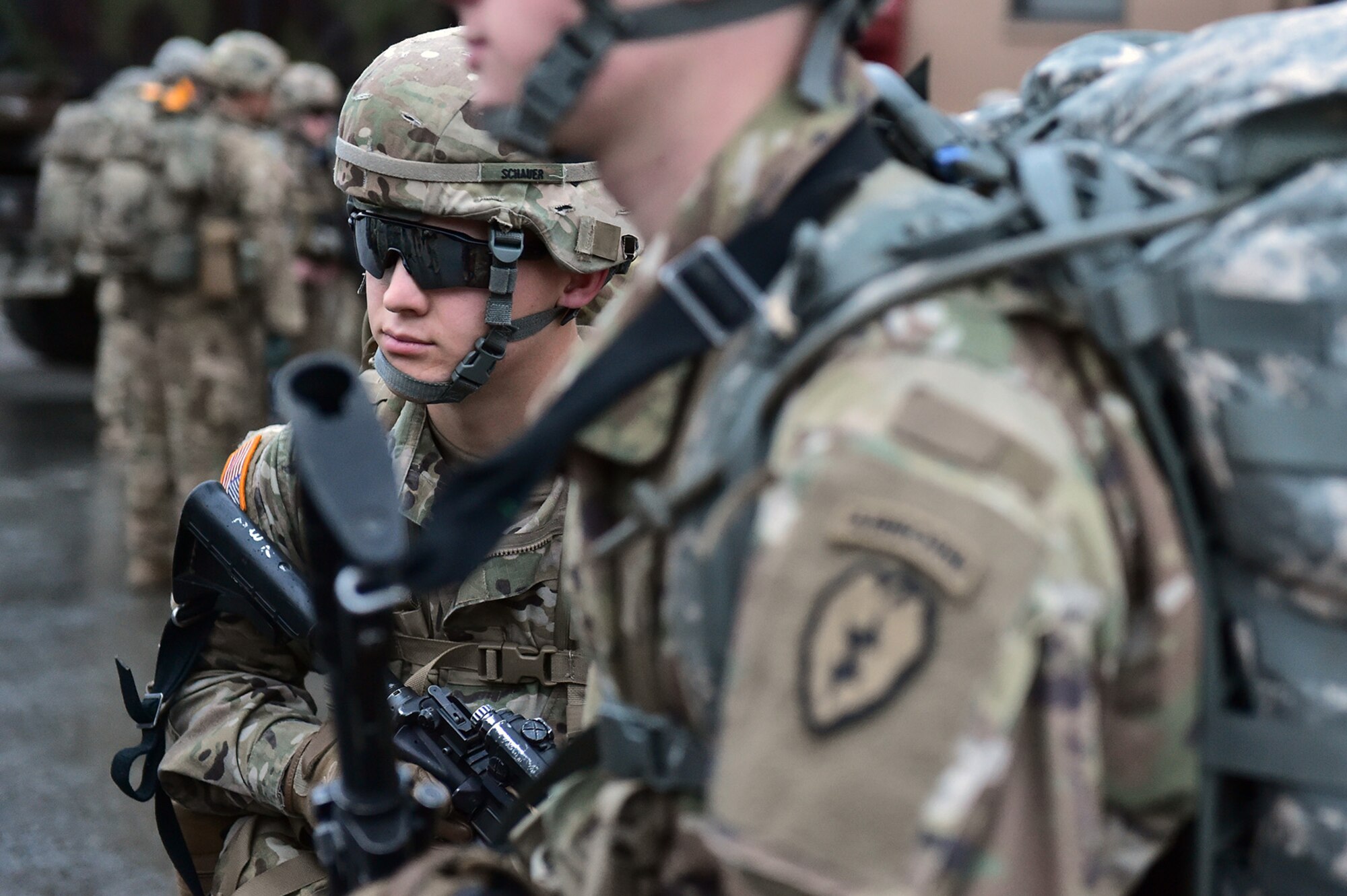Army Pvt. Aaron Schauer, a native of Clearwater, Fla.,  assigned to Comanche Company, 1st Battalion, 501st Parachute Infantry Regiment, 4th Infantry Brigade Combat Team (Airborne), 25th Infantry Division, U.S. Army Alaska, waits for the order to begin a 12-mile tactical foot march on Joint Base Elmendorf-Richardson, Alaska, April 27, 2017. Foot marches are the movement of troops and equipment, mainly by foot, with limited support by vehicles. They are characterized by combat readiness, ease of control, adaptability to terrain, slow rate of movement, and increased personnel fatigue.