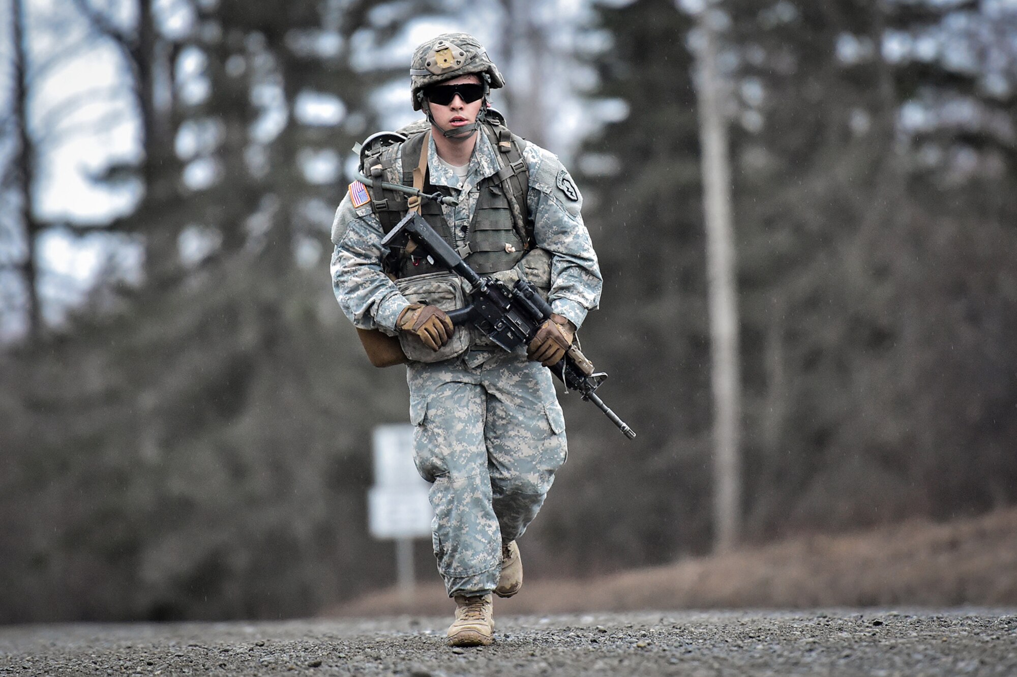 A soldier assigned to Comanche Company, 1st Battalion, 501st Parachute Infantry Regiment, 4th Infantry Brigade Combat Team (Airborne), 25th Infantry Division, U.S. Army Alaska, executes a 12-mile tactical foot march on Joint Base Elmendorf-Richardson, Alaska, April 27, 2017. Foot marches are the movement of troops and equipment, mainly by foot, with limited support by vehicles. They are characterized by combat readiness, ease of control, adaptability to terrain, slow rate of movement, and increased personnel fatigue.