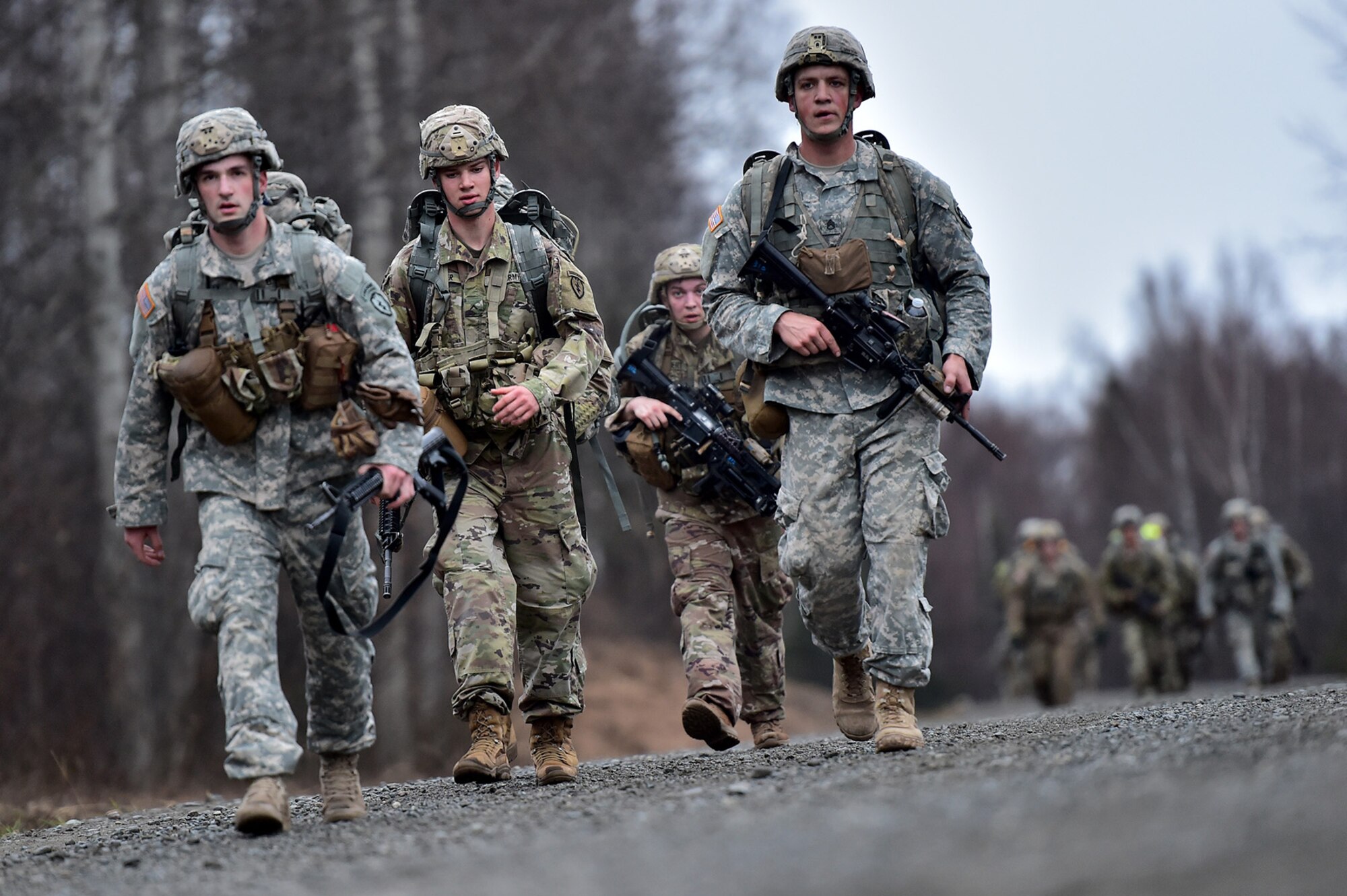 Soldiers assigned to Comanche Company, 1st Battalion, 501st Parachute Infantry Regiment, 4th Infantry Brigade Combat Team (Airborne), 25th Infantry Division, U.S. Army Alaska, execute a 12-mile tactical foot march on Joint Base Elmendorf-Richardson, Alaska, April 27, 2017. Foot marches are the movement of troops and equipment, mainly by foot, with limited support by vehicles. They are characterized by combat readiness, ease of control, adaptability to terrain, slow rate of movement, and increased personnel fatigue.
