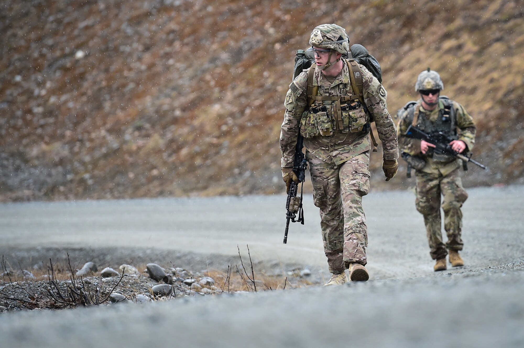 Army Staff Sgt. James Perales, assigned to Comanche Company, 1st Battalion, 501st Parachute Infantry Regiment, 4th Infantry Brigade Combat Team (Airborne), 25th Infantry Division, U.S. Army Alaska, executes a 12-mile tactical foot march with fellow paratroopers on Joint Base Elmendorf-Richardson, Alaska, April 27, 2017. Foot marches are the movement of troops and equipment, mainly by foot, with limited support by vehicles. They are characterized by combat readiness, ease of control, adaptability to terrain, slow rate of movement, and increased personnel fatigue.