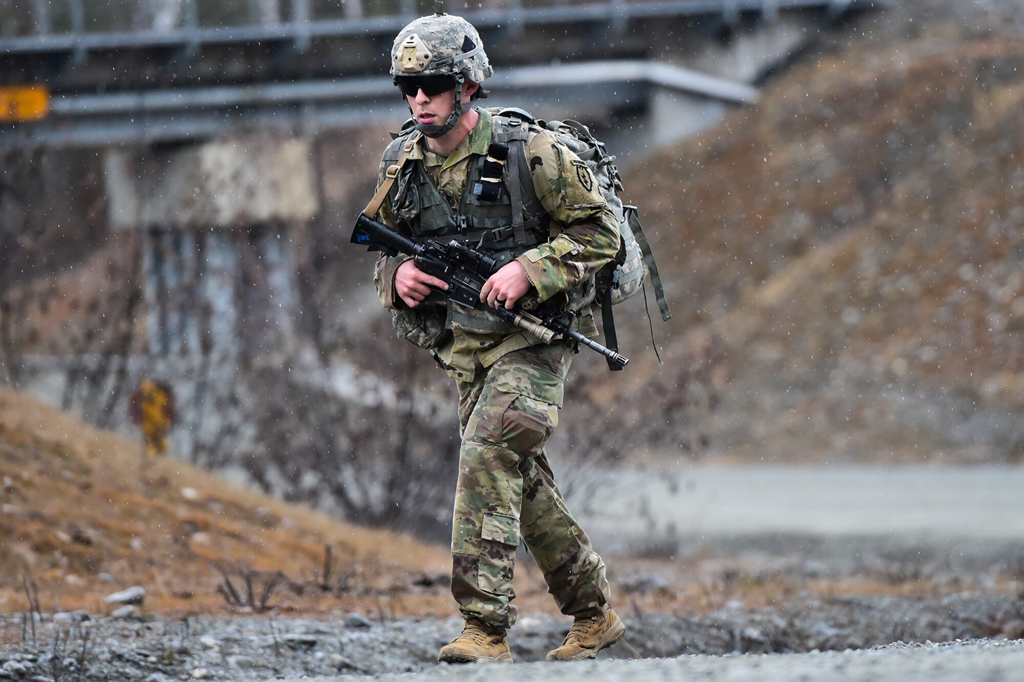 Spc. Brandon Chance, assigned to Comanche Company, 1st Battalion, 501st Parachute Infantry Regiment, 4th Infantry Brigade Combat Team (Airborne), 25th Infantry Division, U.S. Army Alaska, executes a 12-mile tactical foot march with fellow paratroopers on Joint Base Elmendorf-Richardson, Alaska, April 27, 2017. Foot marches are the movement of troops and equipment, mainly by foot, with limited support by vehicles. They are characterized by combat readiness, ease of control, adaptability to terrain, slow rate of movement, and increased personnel fatigue.