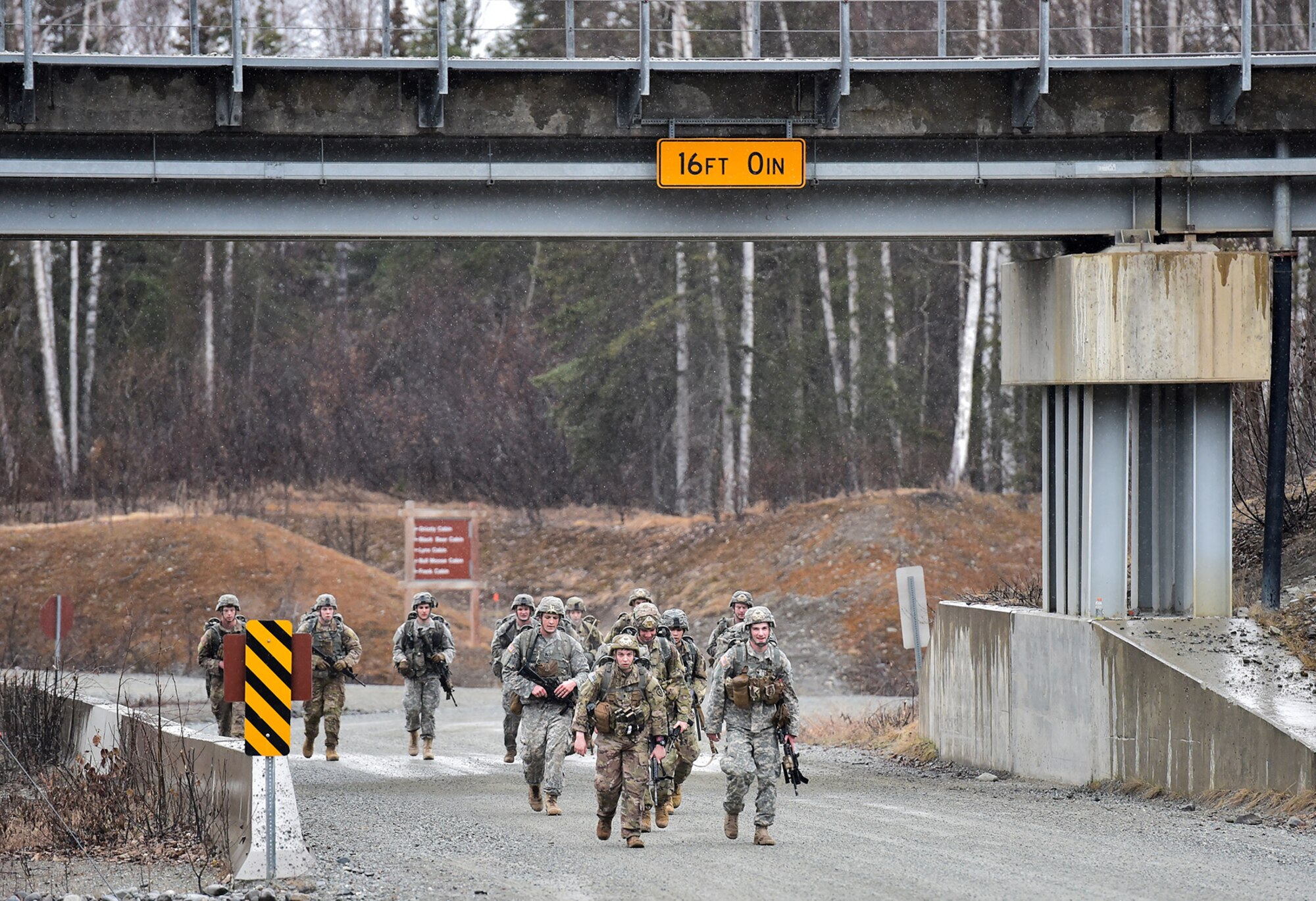 Soldiers assigned to Comanche Company, 1st Battalion, 501st Parachute Infantry Regiment, 4th Infantry Brigade Combat Team (Airborne), 25th Infantry Division, U.S. Army Alaska, execute a 12-mile tactical foot march on Joint Base Elmendorf-Richardson, Alaska, April 27, 2017. Foot marches are the movement of troops and equipment, mainly by foot, with limited support by vehicles. They are characterized by combat readiness, ease of control, adaptability to terrain, slow rate of movement, and increased personnel fatigue.