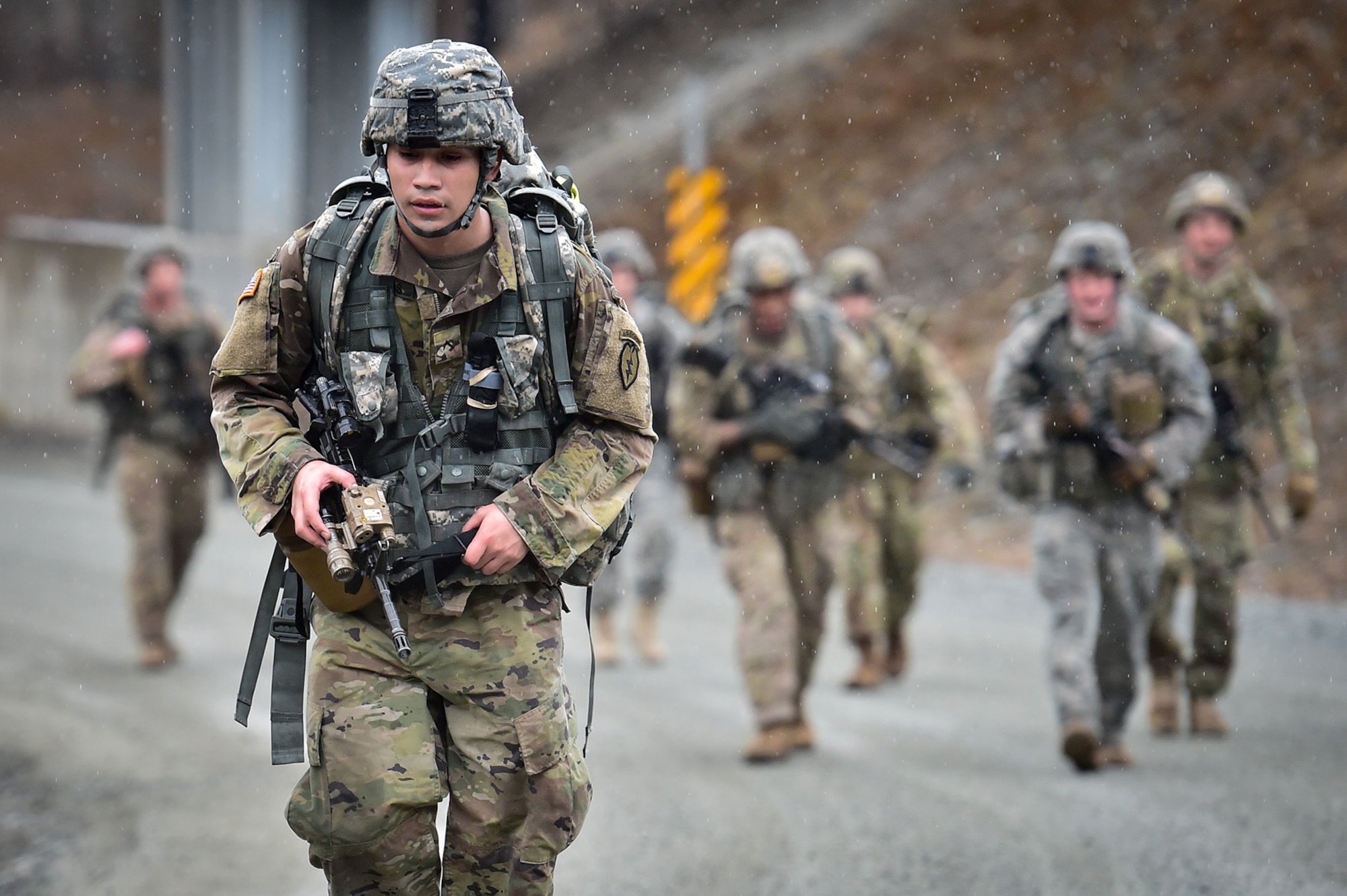 Army Pvt. Joseph Venegas, assigned to Comanche Company, 1st Battalion, 501st Parachute Infantry Regiment, 4th Infantry Brigade Combat Team (Airborne), 25th Infantry Division, U.S. Army Alaska, executes a 12-mile tactical foot march with fellow paratroopers on Joint Base Elmendorf-Richardson, Alaska, April 27, 2017. Foot marches are the movement of troops and equipment, mainly by foot, with limited support by vehicles. They are characterized by combat readiness, ease of control, adaptability to terrain, slow rate of movement, and increased personnel fatigue.