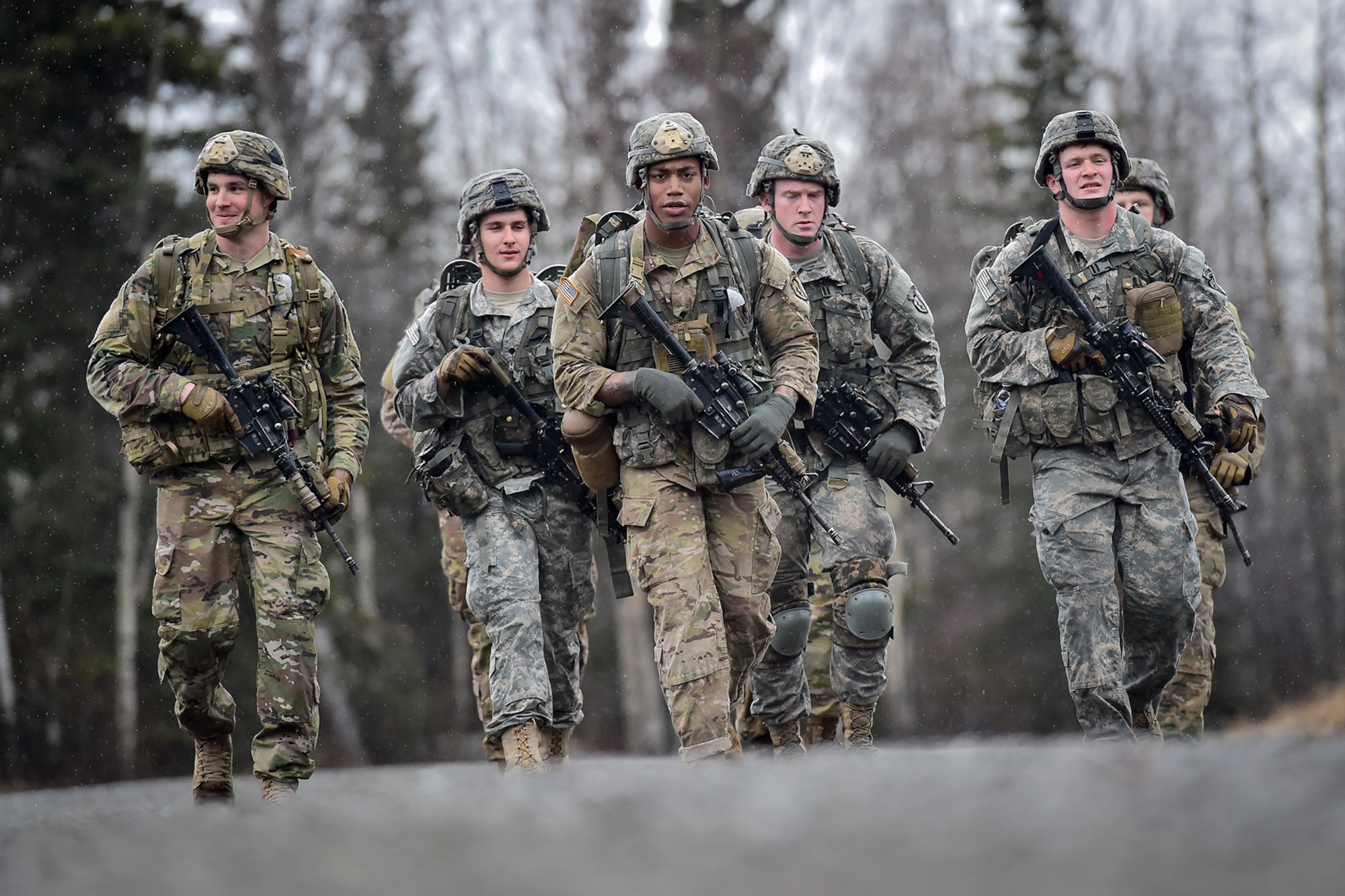 Soldiers assigned to Comanche Company, 1st Battalion, 501st Parachute Infantry Regiment, 4th Infantry Brigade Combat Team (Airborne), 25th Infantry Division, U.S. Army Alaska, execute a 12-mile tactical foot march on Joint Base Elmendorf-Richardson, Alaska, April 27, 2017. Foot marches are the movement of troops and equipment, mainly by foot, with limited support by vehicles. They are characterized by combat readiness, ease of control, adaptability to terrain, slow rate of movement, and increased personnel fatigue.