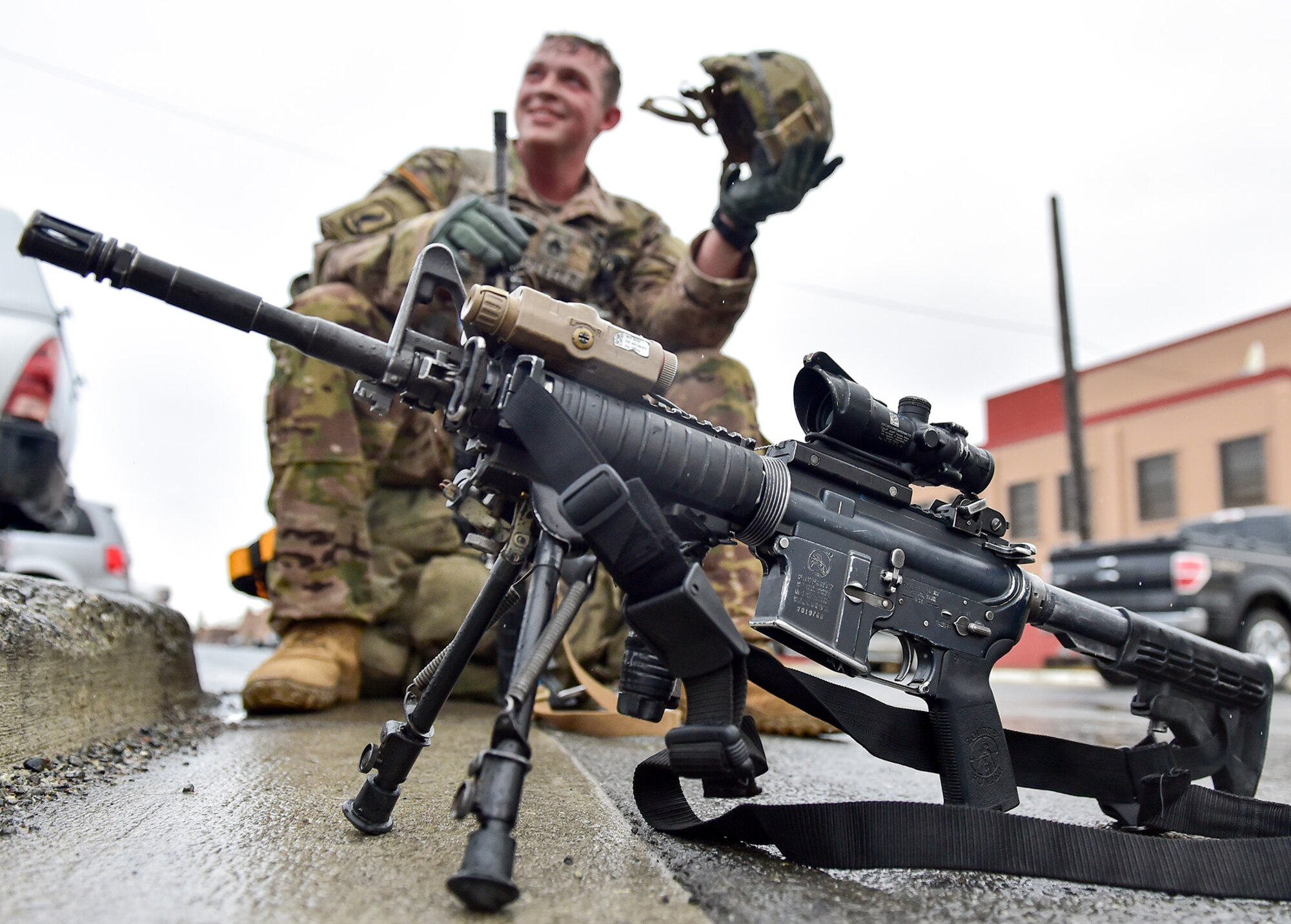 Army Staff Sgt. Ethan Outcel, assigned to Comanche Company, 1st Battalion, 501st Parachute Infantry Regiment, 4th Infantry Brigade Combat Team (Airborne), 25th Infantry Division, U.S. Army Alaska, smiles as he takes off his helmet after a 12-mile tactical foot march on Joint Base Elmendorf-Richardson, Alaska, April 27, 2017. Foot marches are the movement of troops and equipment, mainly by foot, with limited support by vehicles. They are characterized by combat readiness, ease of control, adaptability to terrain, slow rate of movement, and increased personnel fatigue.