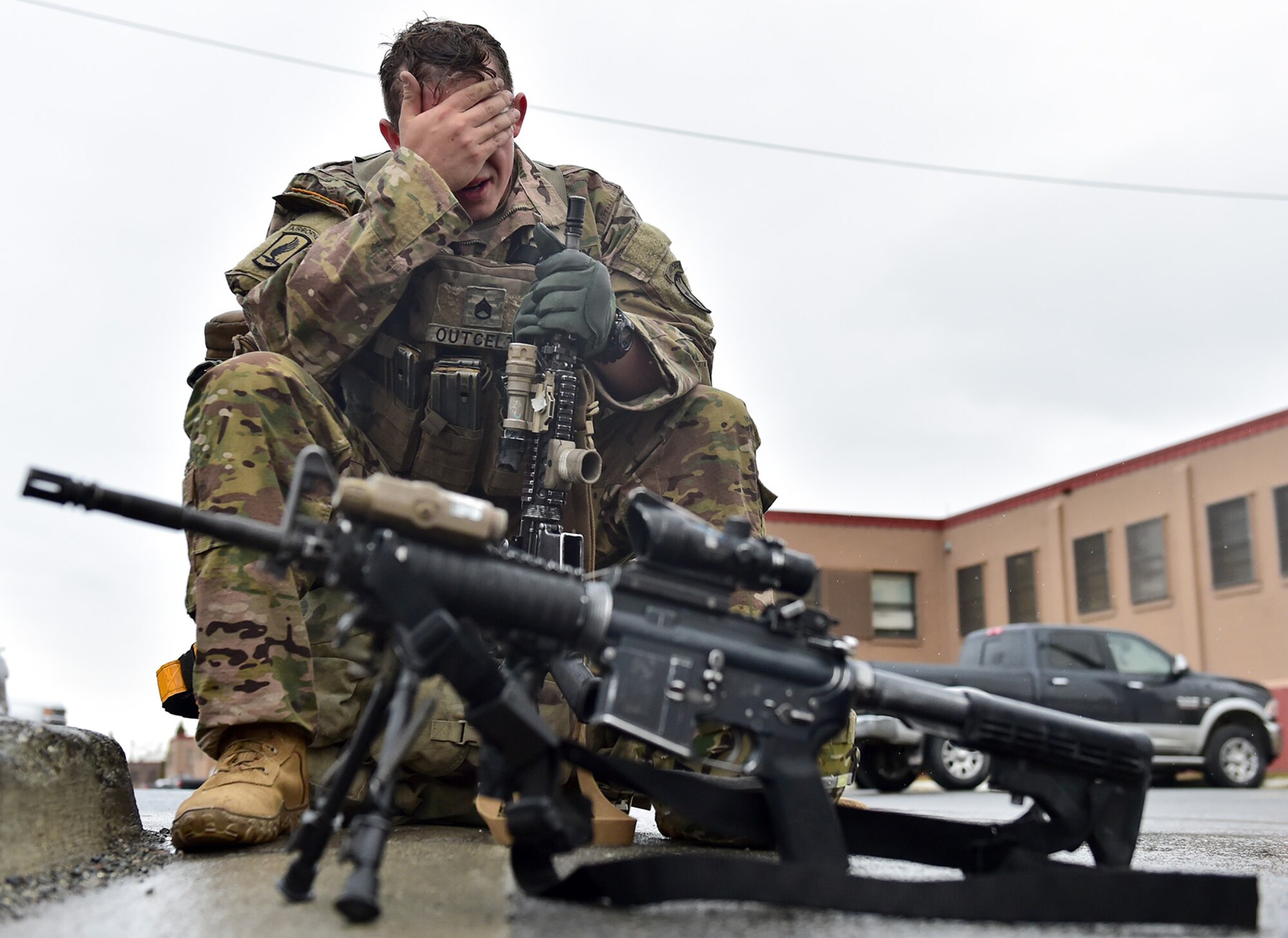 Army Staff Sgt. Ethan Outcel, assigned to Comanche Company, 1st Battalion, 501st Parachute Infantry Regiment, 4th Infantry Brigade Combat Team (Airborne), 25th Infantry Division, U.S. Army Alaska, wipes sweat and rain off his face after a 12-mile tactical foot march on Joint Base Elmendorf-Richardson, Alaska, April 27, 2017. Foot marches are the movement of troops and equipment, mainly by foot, with limited support by vehicles. They are characterized by combat readiness, ease of control, adaptability to terrain, slow rate of movement, and increased personnel fatigue.