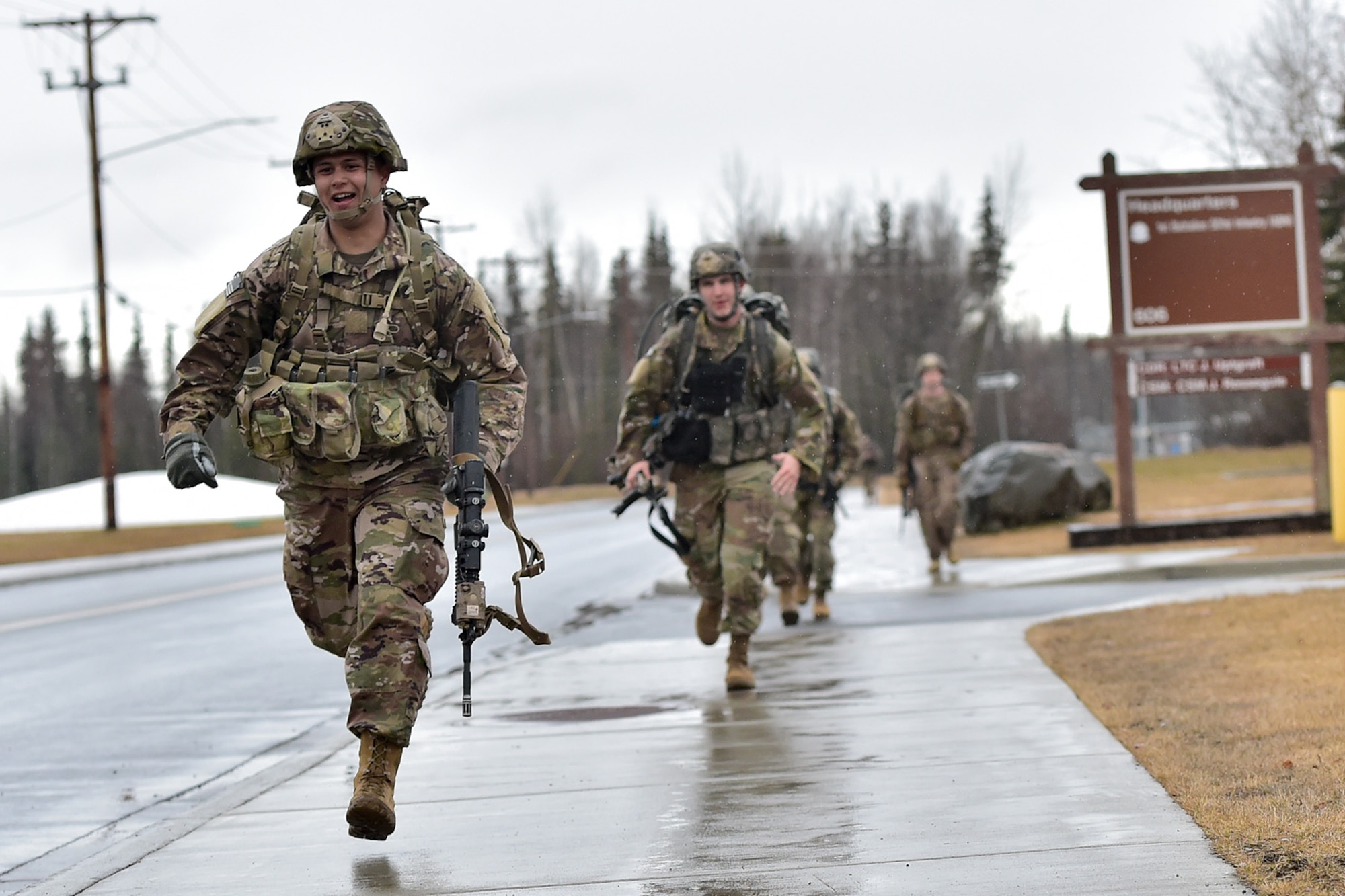 Soldiers assigned to Comanche Company, 1st Battalion, 501st Parachute Infantry Regiment, 4th Infantry Brigade Combat Team (Airborne), 25th Infantry Division, U.S. Army Alaska, sprint to the finish line of a 12-mile tactical foot march on Joint Base Elmendorf-Richardson, Alaska, April 27, 2017. Foot marches are the movement of troops and equipment, mainly by foot, with limited support by vehicles. They are characterized by combat readiness, ease of control, adaptability to terrain, slow rate of movement, and increased personnel fatigue.