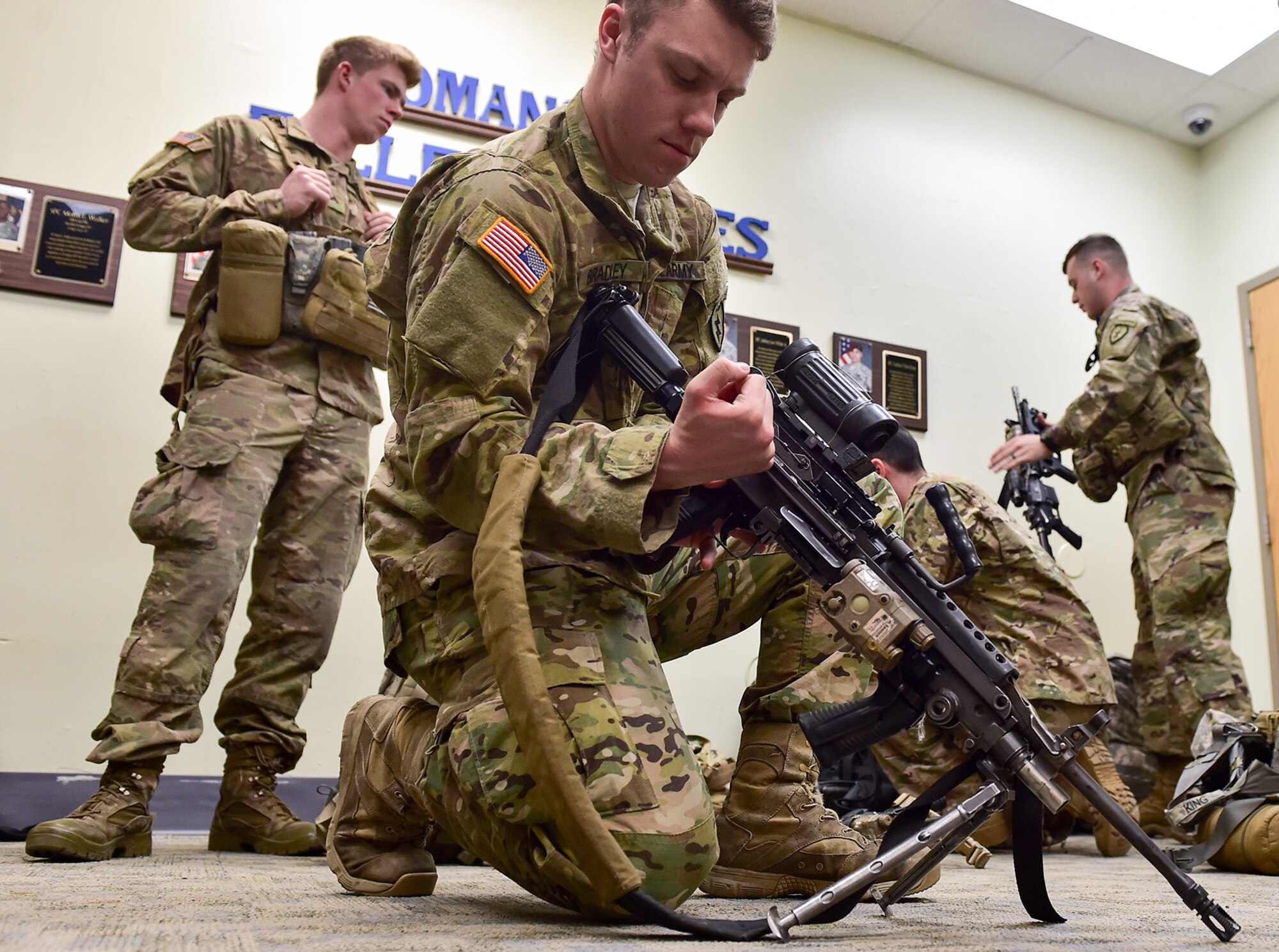 Army Spc. Joe Bradley, a native of Littleton, Colo., assigned to Comanche Company, 1st Battalion, 501st Parachute Infantry Regiment, 4th Infantry Brigade Combat Team (Airborne), 25th Infantry Division, U.S. Army Alaska, prepares his M249 Squad Automatic Weapon for a 12-mile tactical foot march on Joint Base Elmendorf-Richardson, Alaska, April 27, 2017. Foot marches are the movement of troops and equipment, mainly by foot, with limited support by vehicles. They are characterized by combat readiness, ease of control, adaptability to terrain, slow rate of movement, and increased personnel fatigue.