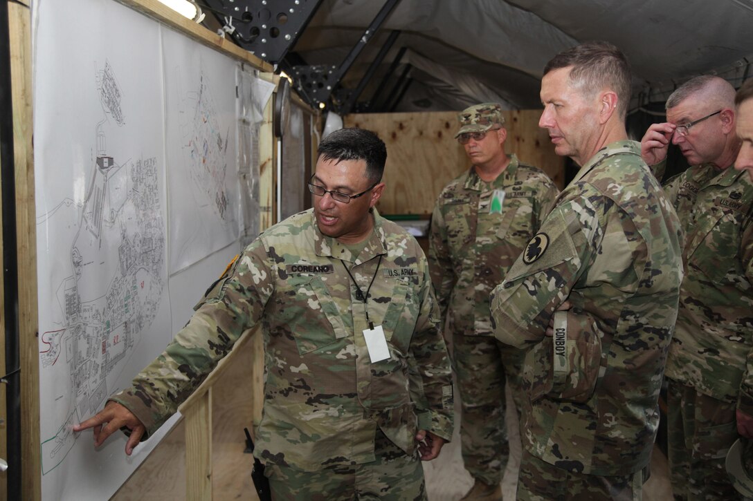 U.S. Army 1st Sgt. Jorge Coreano, with the 471st Engineer Company, briefs Maj. Gen. David Conboy, the U.S. Army Reserves Deputy Commanding General (Operations), as he tours the Beyond the Horizon 2017 operations base at Price Barracks, Belize, April 25, 2017. Beyond the Horizon is a U.S. Southern Command-sponsored, Army South-led exercise designed to provide humanitarian and engineering services to communities in need, demonstrating U.S. support for Belize. (U.S. Army photo by Spc. Gary Silverman)