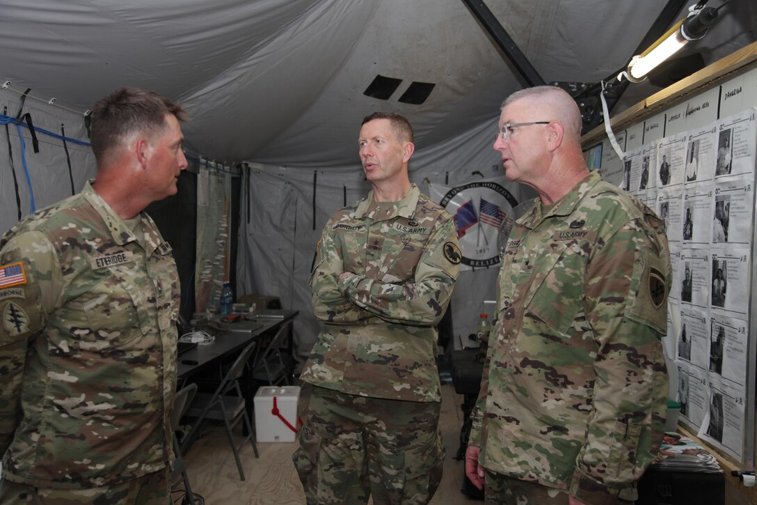 U.S. Army Sgt. 1st Class John Etheridge, with the 128th Mobile Public Affairs Detachment, briefs Maj. Gen. David Conboy, the U.S. Army Reserves Deputy Commanding General (Operations), as he tours the Beyond the Horizon 2017 operations at Price Barracks, Belize, April 25, 2017. Beyond the Horizon is a U.S. Southern Command-sponsored, Army South-led exercise designed to provide humanitarian and engineering services to communities in need, demonstrating U.S. support for Belize. (U.S. Army photo by Spc. Gary Silverman)