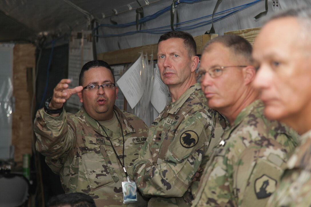 U.S. Army Maj. Jesus Perez, briefs Maj. Gen. David Conboy, U.S. Army Reserves Deputy Commanding General (Operations), as he tours the Beyond the Horizon 2017 operations at Price Barrack, Belize, April 25, 2017. Beyond the Horizon is a U.S. Southern Command-sponsored, Army South-led exercise designed to provide humanitarian and engineering services to communities in need, demonstrating U.S. support for Belize. (U.S. Army photo by Spc. Gary Silverman)