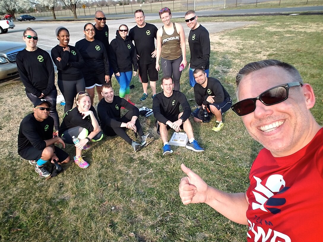 Christopher Parr, 932nd Airlift Wing Public Affairs specialist, poses with the Scott Health Promotion Running Clinic group leaders March 8, 2017, Scott Air Force Base, Illinois.  Parr documented his journey to becoming a better runner in the commentaries section of the 932nd AW website. http://www.932aw.afrc.af.mil/News/Commentaries.aspx  (U.S. Air Force photo by Christopher Parr)