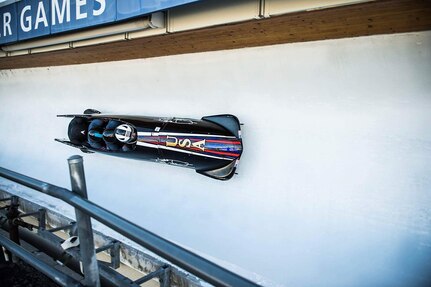 U.S. Air Force Capt. David Simon is second behind the driver as the sled speeds down the icy track during the U.S. Bobsled Team Trials in Park City, Utah, on Nov. 2, 2016. (Courtesy photo)