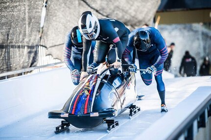 U.S. Air Force Capt. David Simon (right) pushes the bobsled before hopping in for a run at the U.S.Bobsled Team Trials in Park City, Utah, on Nov. 2, 2016. (Courtesy photo)