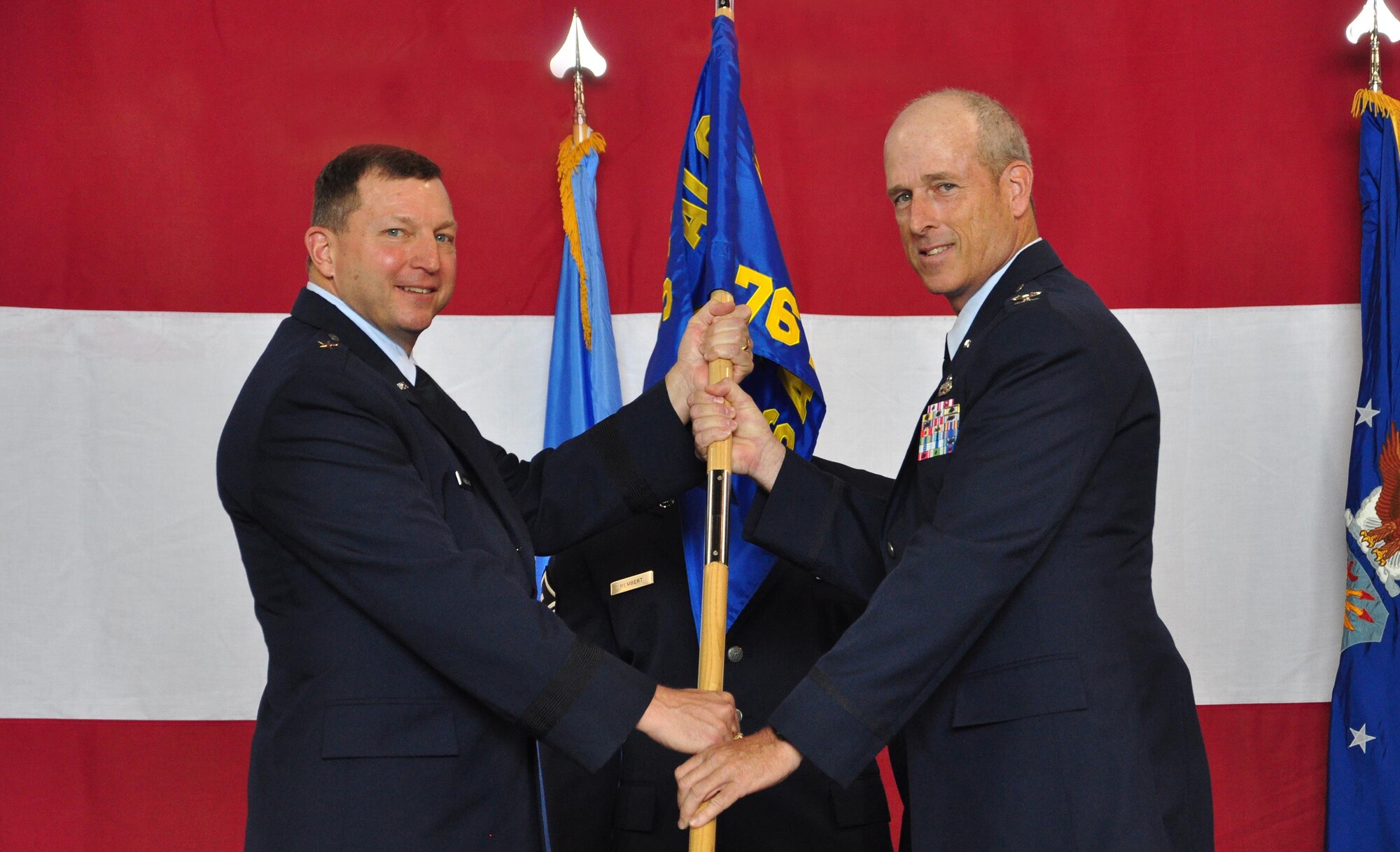 Colonel Michael Allison accepts the guidon from Brigadier General Mark Johnson as he assumes command of the 76th Aerospace Maintenance Group.