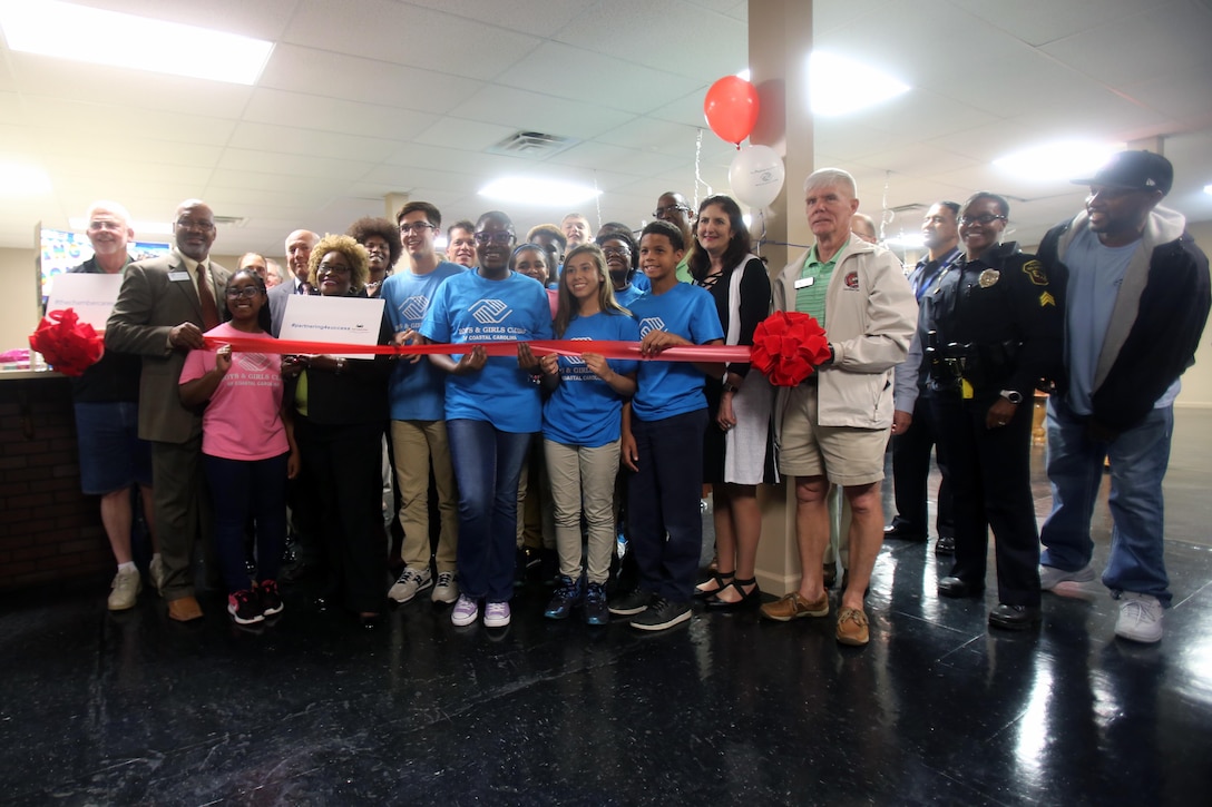 Local members of the community gather during a Boys & Girls Club opening at New Bern, N.C., April 24, 2017. Marines assigned to Marine Wing Support Squadron 272, Marine Aircraft Group 26, 2nd Marine Air Wing joined the local community for the reveal of the youth center after it was constructed from the remains of an old nightclub. The work the Marines accomplished made it possible to jump start the project. (U.S. Marine Corps photo by Sgt. N.W. Huertas/Released)