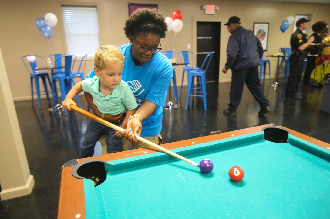 Children enjoy their new facilities during a Boys & Girls Club opening at New Bern, N.C., April 24, 2017. Marines assigned to Marine Wing Support Squadron 272, Marine Aircraft Group 26, 2nd Marine Air Wing joined the local community for the reveal of the youth center after it was constructed from the remains of an old nightclub. 13 Marines assigned to the squadron volunteered for the construction of the facility. (U.S. Marine Corps photo by Sgt. N.W. Huertas/Released)