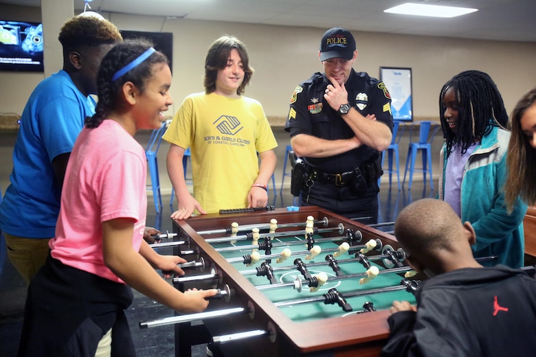 Children and local members of the community gather during a Boys & Girls Club opening at New Bern, N.C., April 24, 2017. Marines assigned to Marine Wing Support Squadron 272, Marine Aircraft Group 26, 2nd Marine Air Wing joined the local community for the reveal of the youth center after it was constructed from the remains of an old nightclub. Marines had the opportunity to give back to the community and provide young adults with a safe place to grow and be mentored. (U.S. Marine Corps photo by Sgt. N.W. Huertas/Released)