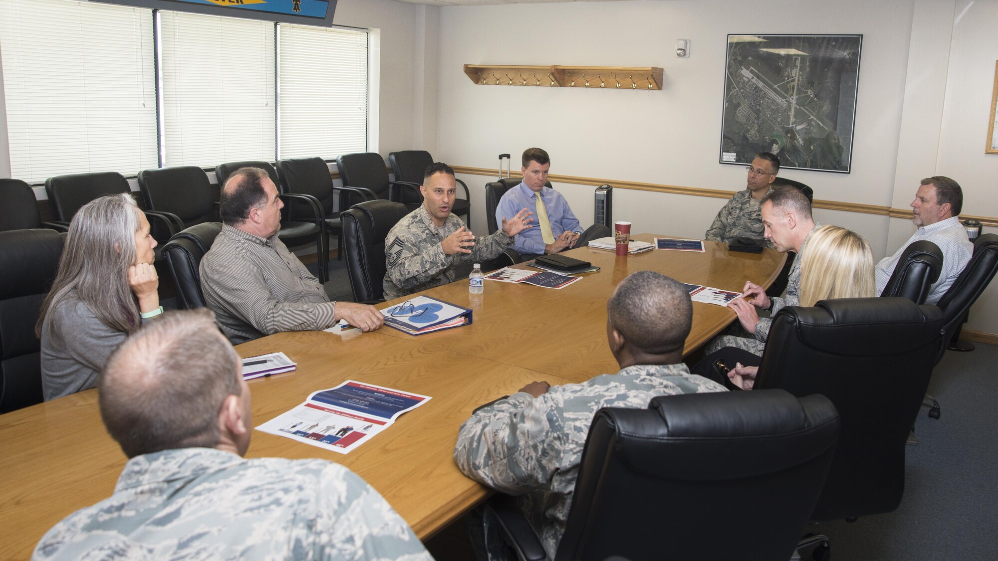 Chief Master Sgt. Luis Reyes, Senior Enlisted Advisor for the Army & Air Force Exchange Service, talks with leadership from the 436th Mission Support Group April 27, 2017, at Dover Air Force Base, Del. Reyes serves as the focal point for communications between Exchange leadership and Army and Air Force active duty, Guard, Reserve, family members and retirees. (U.S. Air Force photo by Staff Sgt. Jared Duhon)