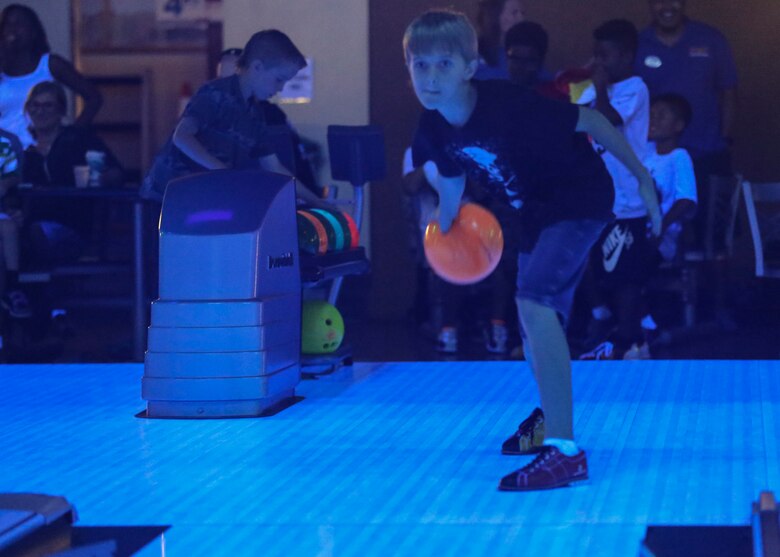 Ryan Hastey prepares to roll a bowling ball during the annual “Strike Out Child Abuse” event at K-Bay Lanes aboard Marine Corps Base Hawaii, April 26, 2017. The purpose of this event was to raise awareness and reach out to the community about ways to protect children from abuse. (U.S. Marine Corps Photo by Lance Cpl. Matthew Kirk)