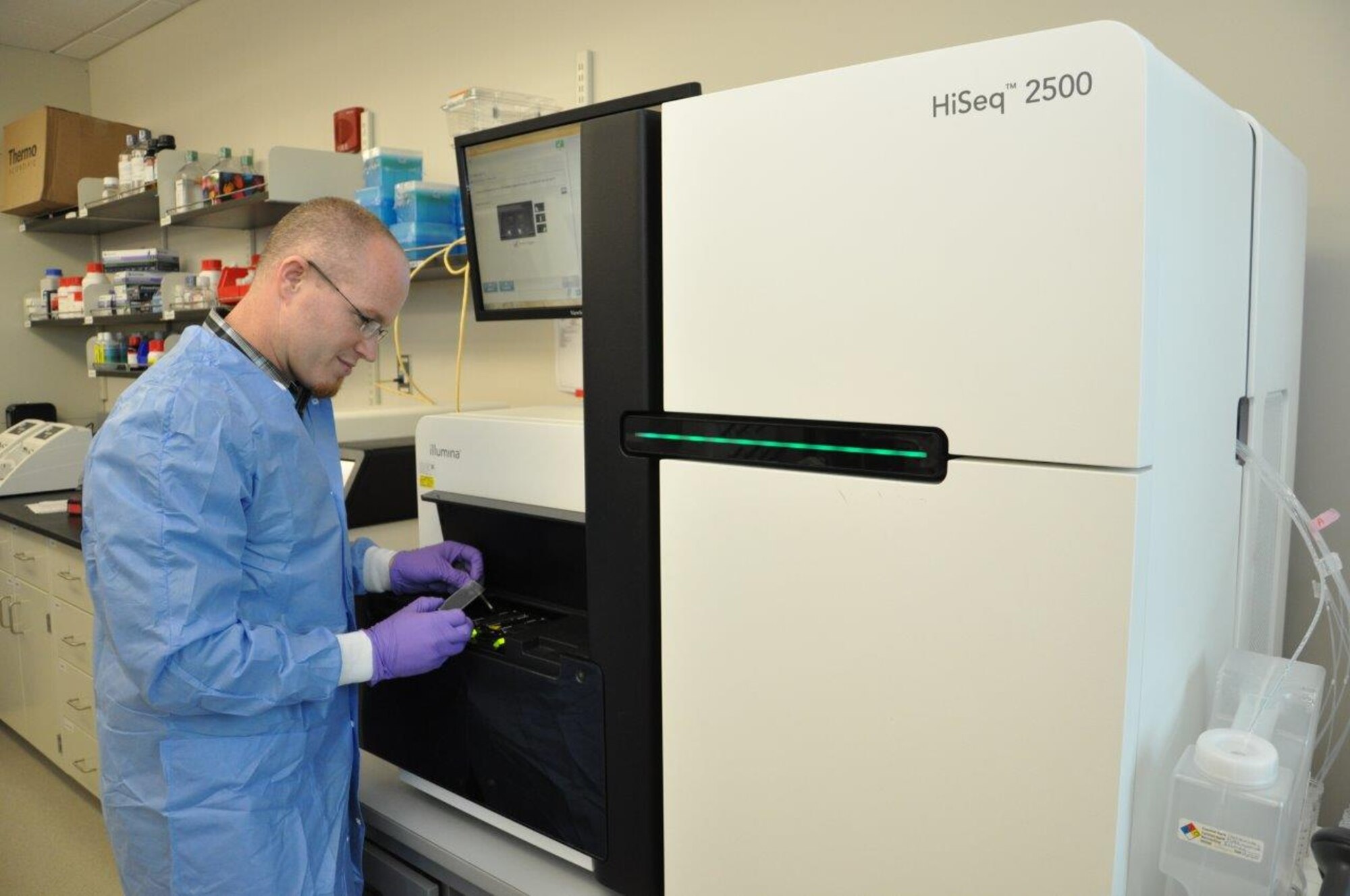 Dr. Richard Chapleau, Research Biochemist with United States School of Aerospace Medicine, operates one of the lab’s genome sequencers.  (U.S. Air Force photo/Will Huntington)