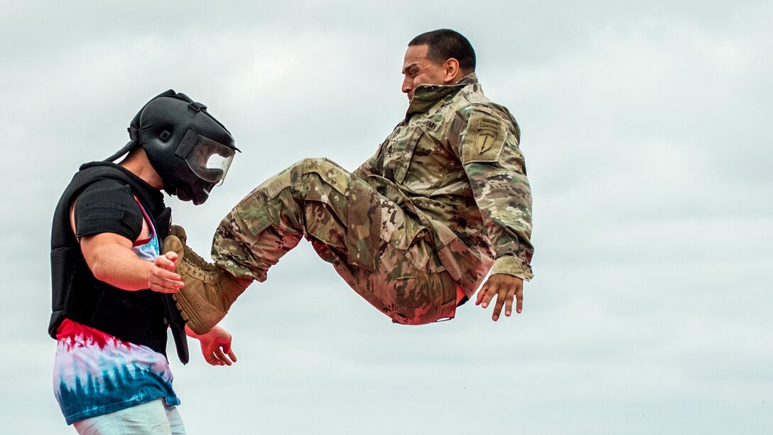 A soldier demonstrates combat techniques on a volunteer from the audience during the 6th Ranger Training Battalion’s open house at Eglin Air Force Base, Fla., April 29, 2017. The event allowed the public to learn how Rangers train and operate. Air Force photo by Samuel King Jr.