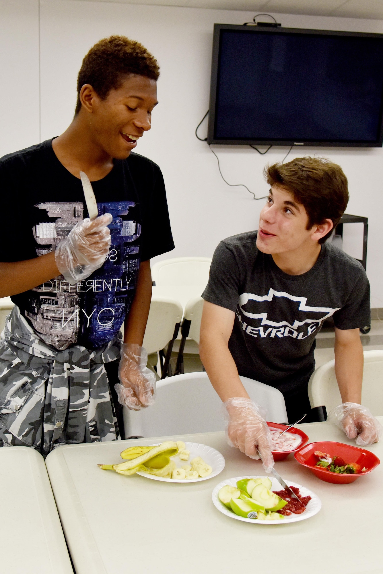 Robert White and Jacob Downs, Teen Chef Challenge participants, prepare their meal during Teen Chef Challenge at the Taylor Chapel on Goodfellow Air Force Base, Texas, April 28, 2017. Robert and Jacob teamed up together to faceoff against four other teams in a healthy food contest. (U.S. Air Force photo by Staff Sgt. Joshua Edwards/Released)
