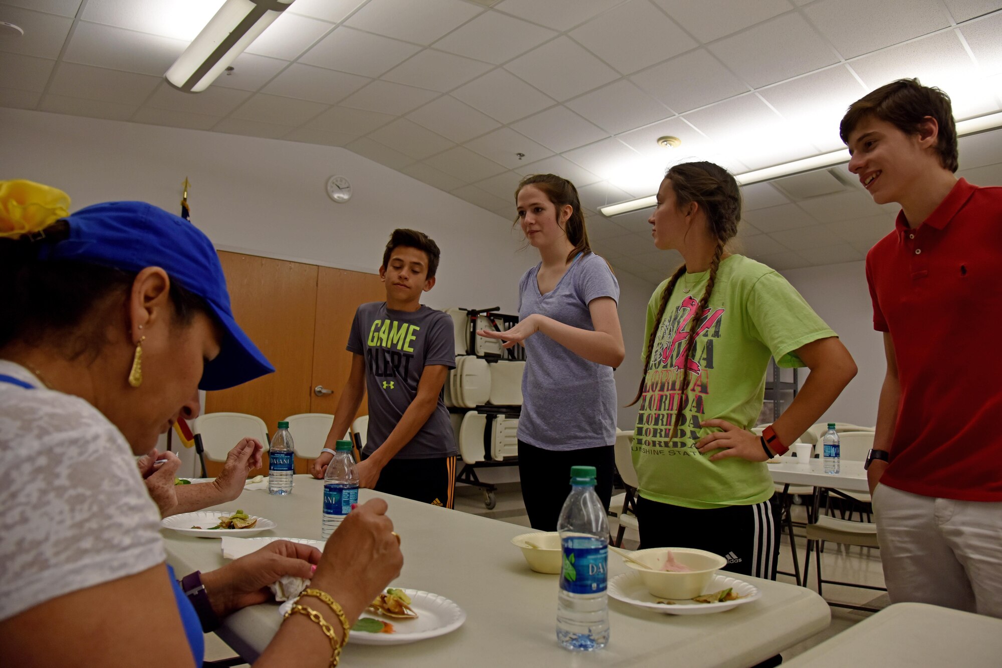 A Teen Cook Challenge team presents their food to judges at the Taylor Chapel on Goodfellow Air Force Base, Texas, April 28, 2017. Judges scored the food on taste, presentation and how healthy it was. (U.S. Air Force photo by Staff Sgt. Joshua Edwards/Released)