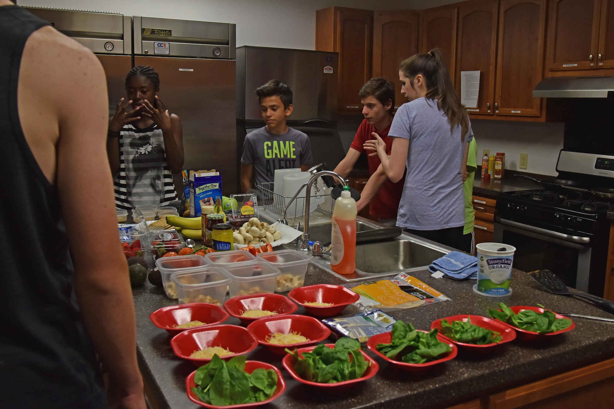 Teen Chef Challenge contestants picked out their ingredients at the Taylor Chapel on Goodfellow Air Force Base, Texas, April 28, 2017. The goal of the contests was to teach the teens to make a healthy choices. (U.S. Air Force photo by Staff Sgt. Joshua Edwards/Released)