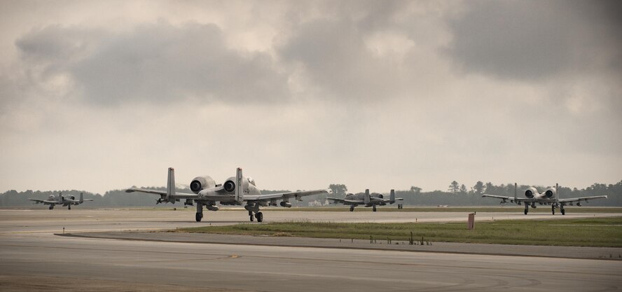 A-10C Thunderbolt II aircraft taxi down the runway, April 28, 2017 at Moody Air Force Base. The 75th FS departed for Combat Hammer, an air-to-ground exercise hosted at Hill Air Force Base, Utah. The exercise is designed to collect and analyze data on the performance of precision weapons and measure their suitability for use in combat. (U.S. Air Force photo by Andrea Jenkins)