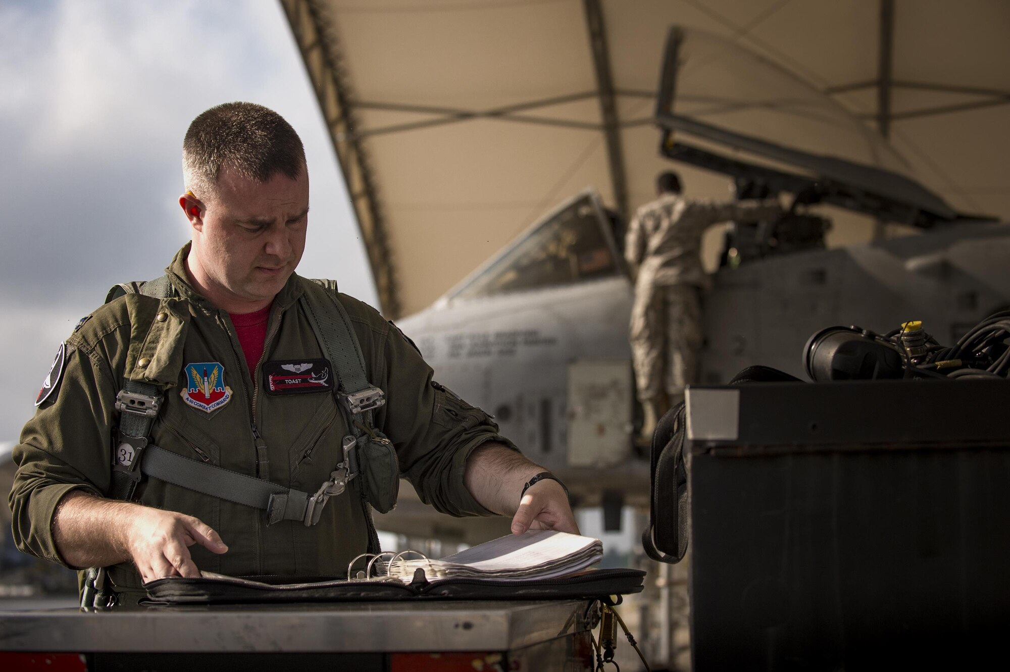 An A-10C Thunderbolt II pilot from the 75th Fighter Squadron fills out pre-flight inspection paperwork, April 28, 2017, at Moody Air Force Base, Ga. The 75th FS departed for Combat Hammer, an air-to-ground exercise hosted at Hill Air Force Base, Utah. The exercise is designed to collect and analyze data on the performance of precision weapons and measure their suitability for use in combat. (U.S. Air Force photo by Andrea Jenkins)