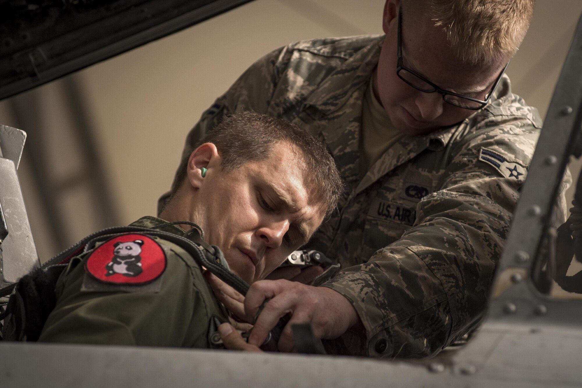 A crew chief with the 75th Aircraft Maintenance Unit helps Capt. Joseph Morrin, 75th Fighter Squadron A-10C Thunderbolt II pilot, with his safety harness prior to take off, April 28, 2017, at Moody Air Force Base, Ga. The 75th FS departed for Combat Hammer, an air-to-ground exercise hosted at Hill Air Force Base, Utah. The exercise is designed to collect and analyze data on the performance of precision weapons and measure their suitability for use in combat. (U.S. Air Force photo by Andrea Jenkins)