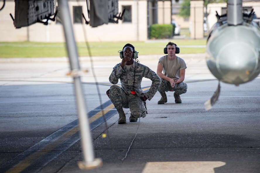 Crew chiefs with the 75th Aircraft Maintenance Unit preform preflight inspections, April 28, 2017, at Moody Air Force Base, Ga. The 75th FS departed for Combat Hammer, an air-to-ground exercise hosted at Hill Air Force Base, Utah. The exercise is designed to collect and analyze data on the performance of precision weapons and measure their suitability for use in combat. (U.S. Air Force photo by Andrea Jenkins) 