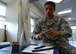U.S. Air Force Staff Sgt. Marco Davis, 20th Medical Operations Squadron physical medicine technician, cuts Kinesio Tape in the physical therapy clinic at Shaw Air Force Base, S.C., May 1, 2017. Davis applied the tape on patients for therapeutic purposes, such as aligning muscles, stabilizing joints and improving blood flow. (U.S. Air Force photo by Airman 1st Class Kathryn R.C. Reaves)
