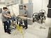 Jordan Piper and Fernando Jacobo, both pneudraulics systems mechanics with the 550th Commodities Maintenance Squadron’s Air Accessories Squadron, set up an F-22 air cooling turbine on a test rig in order to meet technical order requirements to make sure it produces cool air in Bldg. 200’s Air Test Cells.  (Air Force photo by Kelly White)