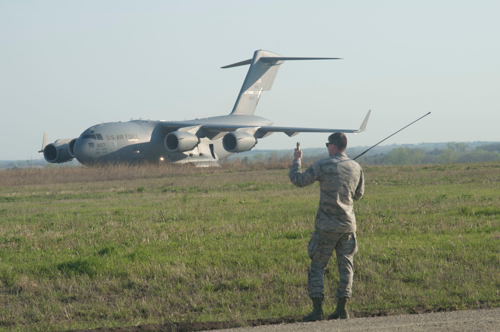 Senior Airman Erwin Fein, an air traffic controller with the 621 Contingency Response Group at Joint Base McGuire-Dix-Lakehurst, checks weather data for a landing U.S. Air Force C-17 Globemaster, during joint exercise Cerberus Strike 17-01 at Savage Army Air Field, Kansas on April 17, 2017. The joint exercise allows members the opportunity to rehearse potential real-world situations, including in cargo uploading and downloading on aircraft. (U.S. Air Force photo by Staff Sgt. Robert Waggoner/RELEASED)