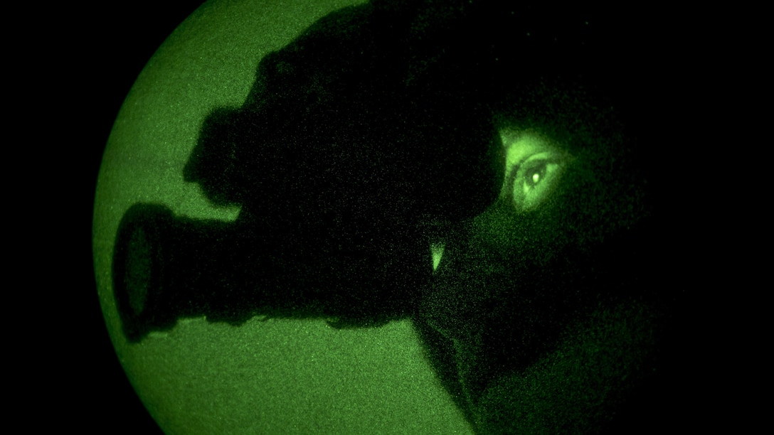 Marine Corps Sgt. Paul Guillen uses his night vision goggles during a weapons and instructor course final exercise at the Chocolate Mountain Aerial Gunnery Range in California, April 27, 2017. Guillen is a crew chief assigned to Marine Light Attack Helicopter Squadron 169. Marine Corps photo by Cpl. AaronJames B. Vinculado